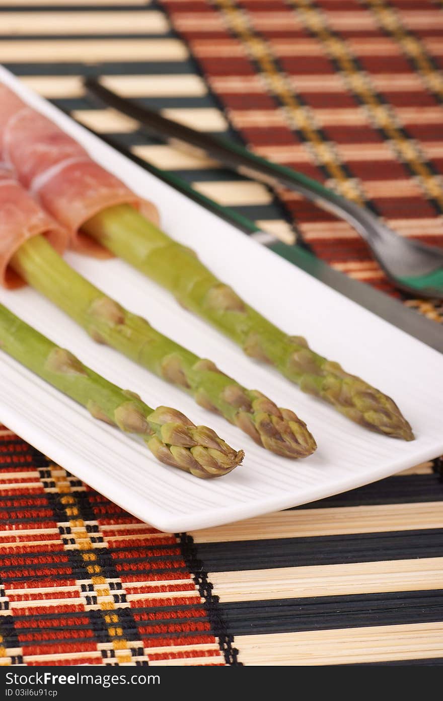 Steamed asparagus and prosciutto di Parma. Selective focus, shallow DOF. Steamed asparagus and prosciutto di Parma. Selective focus, shallow DOF