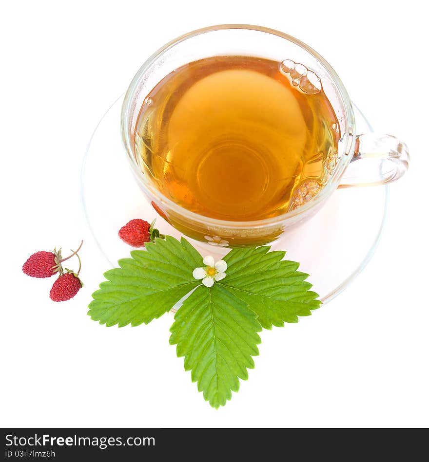 Cup of tea and wild strawberries on a white background