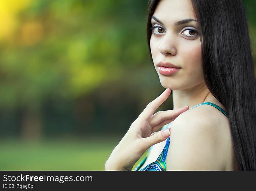 Beautiful girl over nature background.