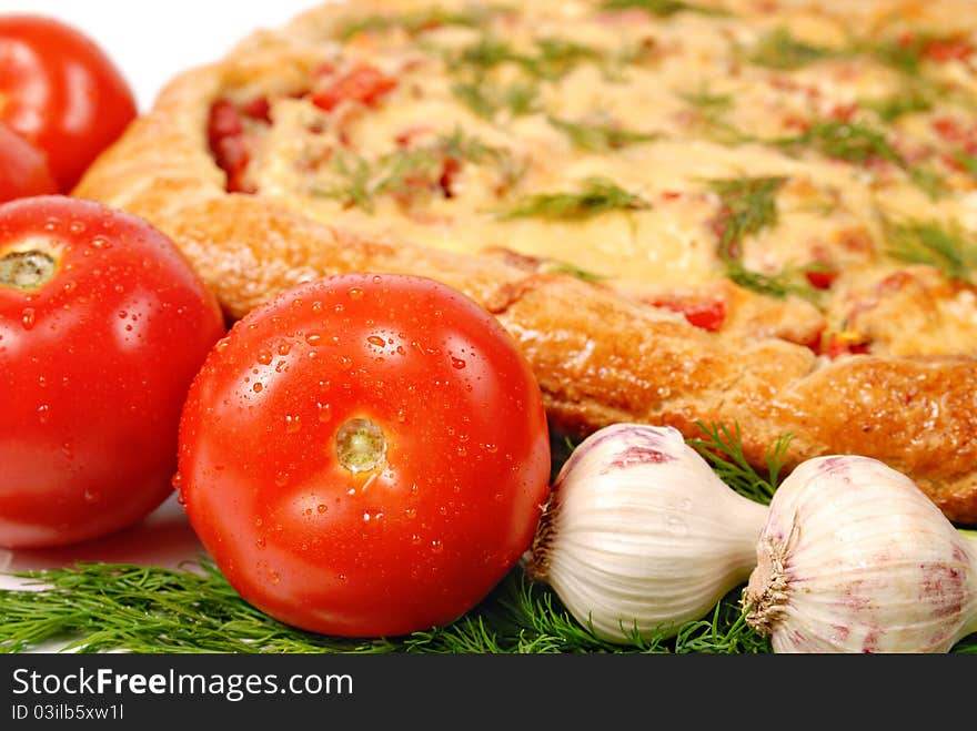 Pizza, tomatoes and garlic close up