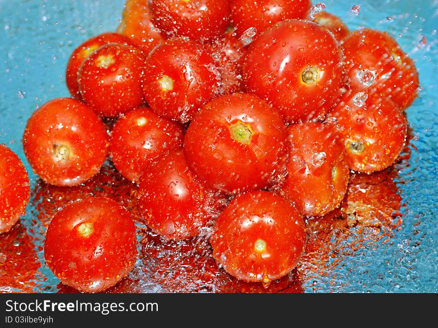 Fresh Tomatoes In Water And Splashes