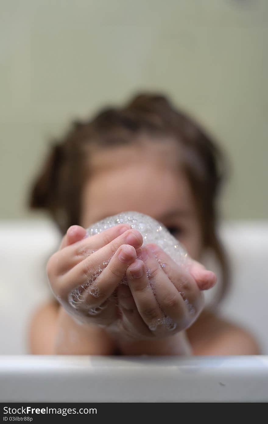 Little girl a bath with foam. Little girl a bath with foam