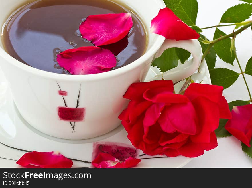 Rose tea, and red rose with petals