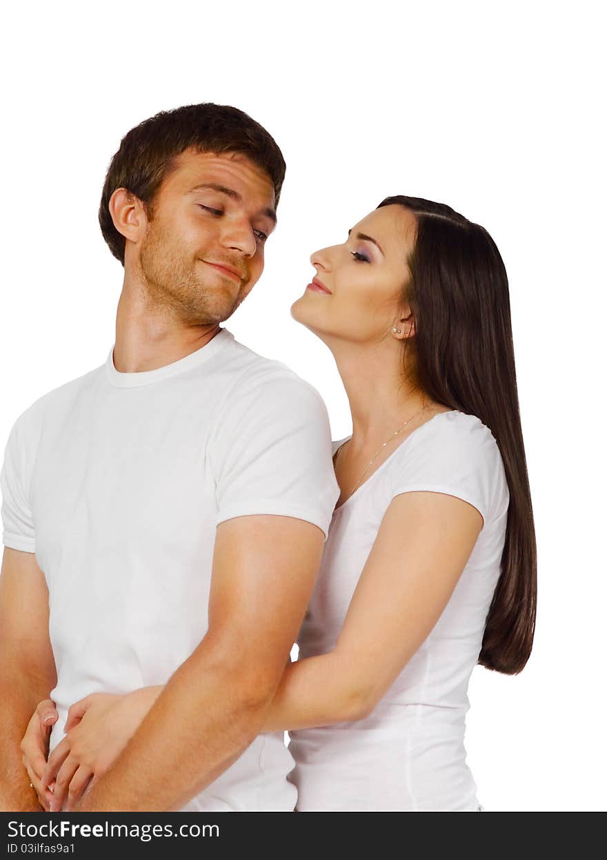 Portrait of a young beautiful smiling couple in studio