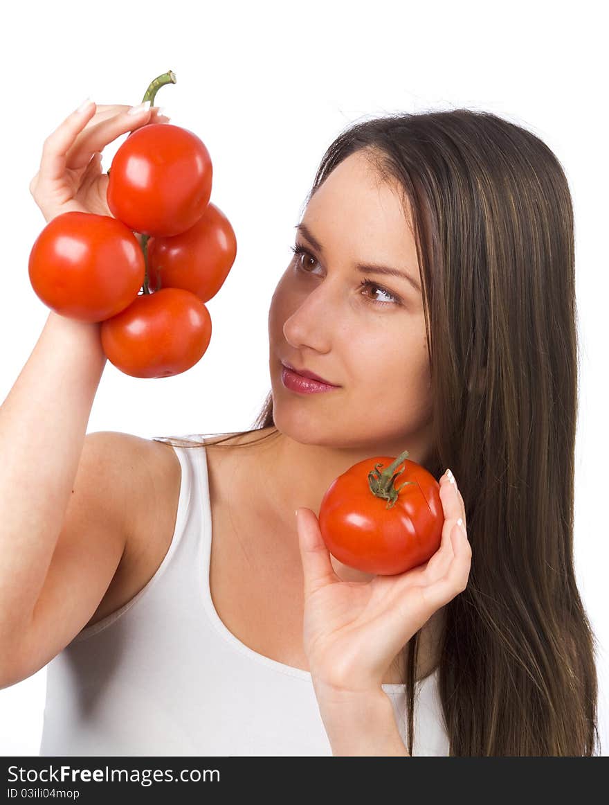 Young woman holding fresh tomatoes