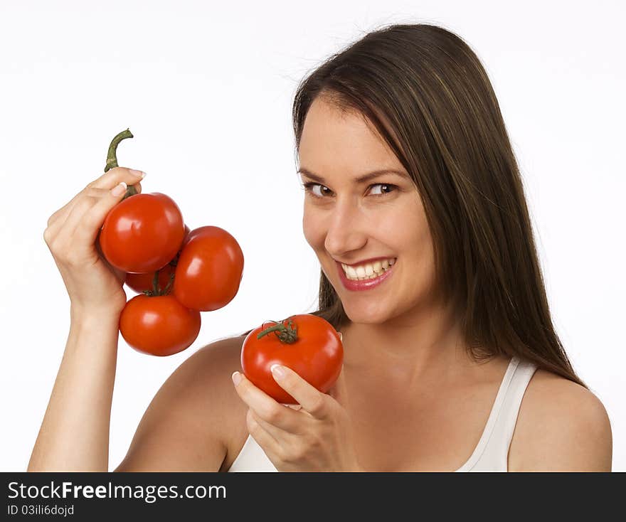 Young woman holding tomatoes