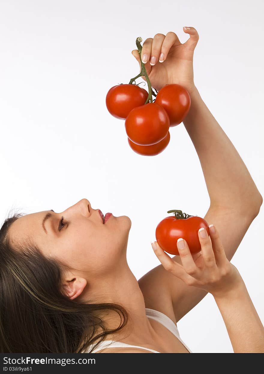 Young Woman Holding Fresh Tomatoes