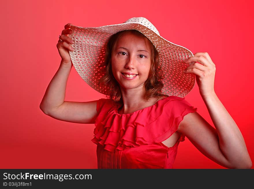 Lady In Red With Summer Hat