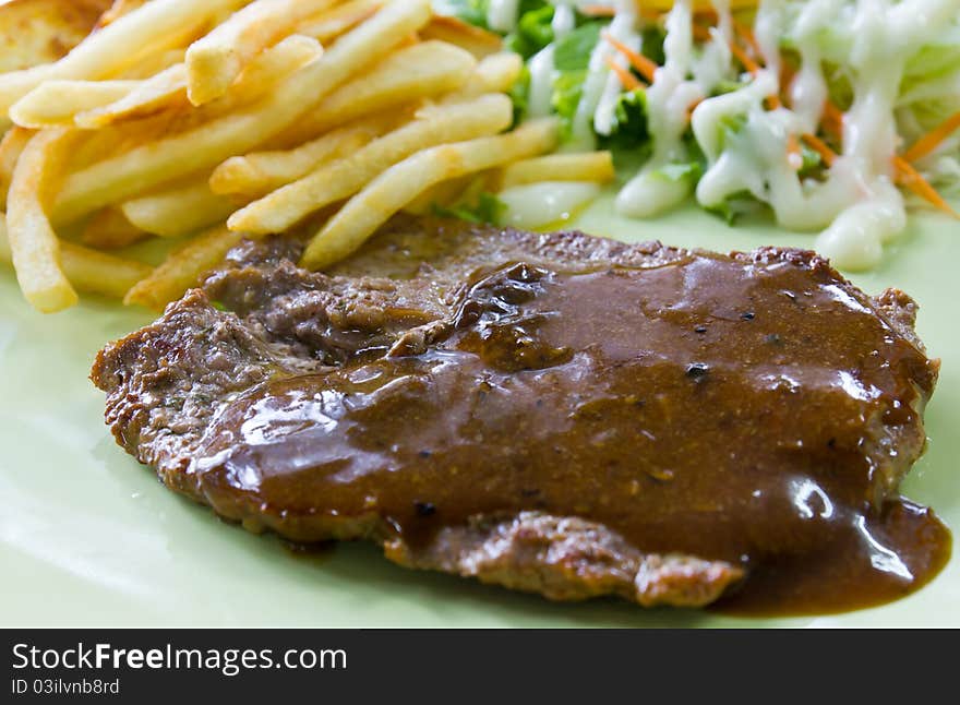 Steak with fresh vegetables salad