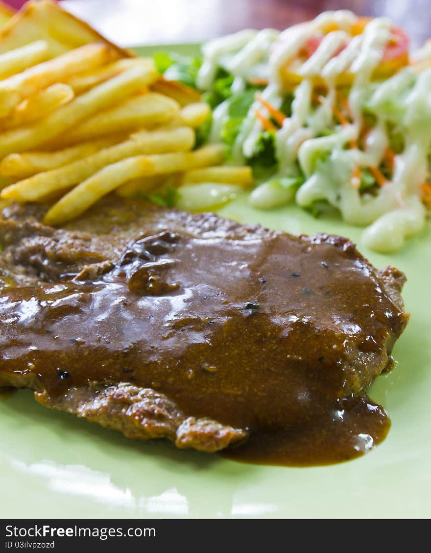 Steak with fresh vegetables salad