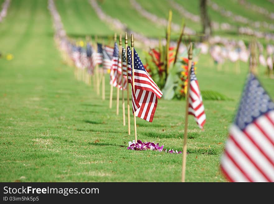 A row of flags at the grave sites on Memorial Day (2011) at the Punch Bowl National Cemetery on the Island of Oahu in Hawaii.