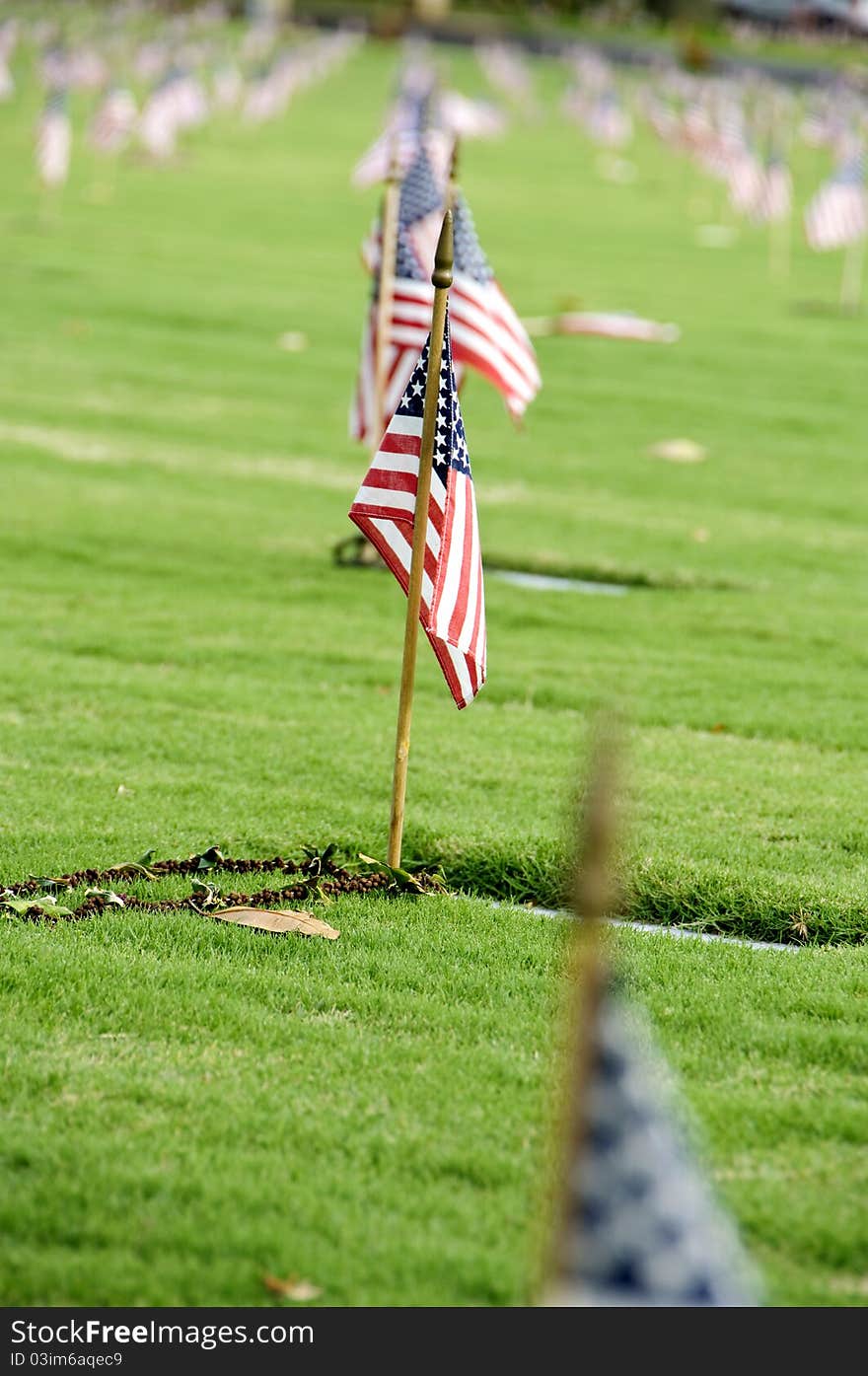 A row of flags at the grave sites on Memorial Day (2011) at the Punch Bowl National Cemetery on the Island of Oahu in Hawaii.