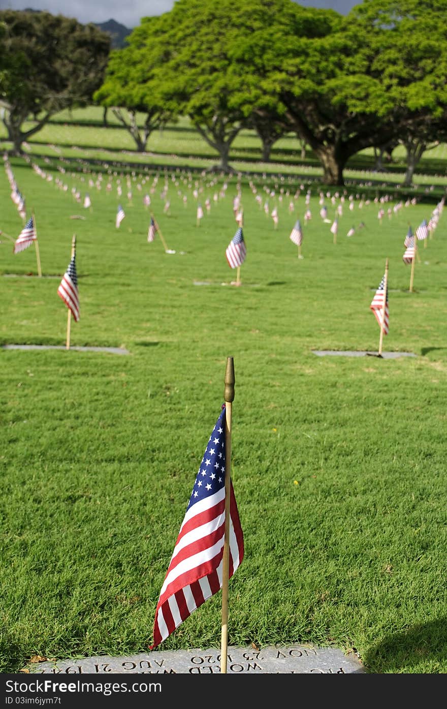 A row of flags at the grave sites on Memorial Day (2011) at the Punch Bowl National Cemetery on the Island of Oahu in Hawaii.