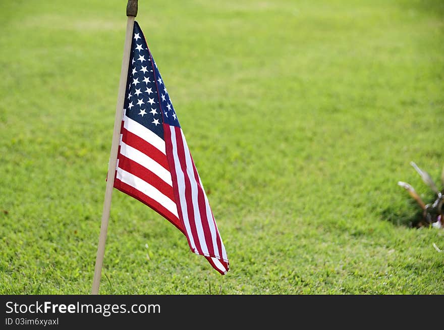 A USA flag at the grave site on Memorial Day (2011) at the Punch Bowl National Cemetery on the Island of Oahu in Hawaii.