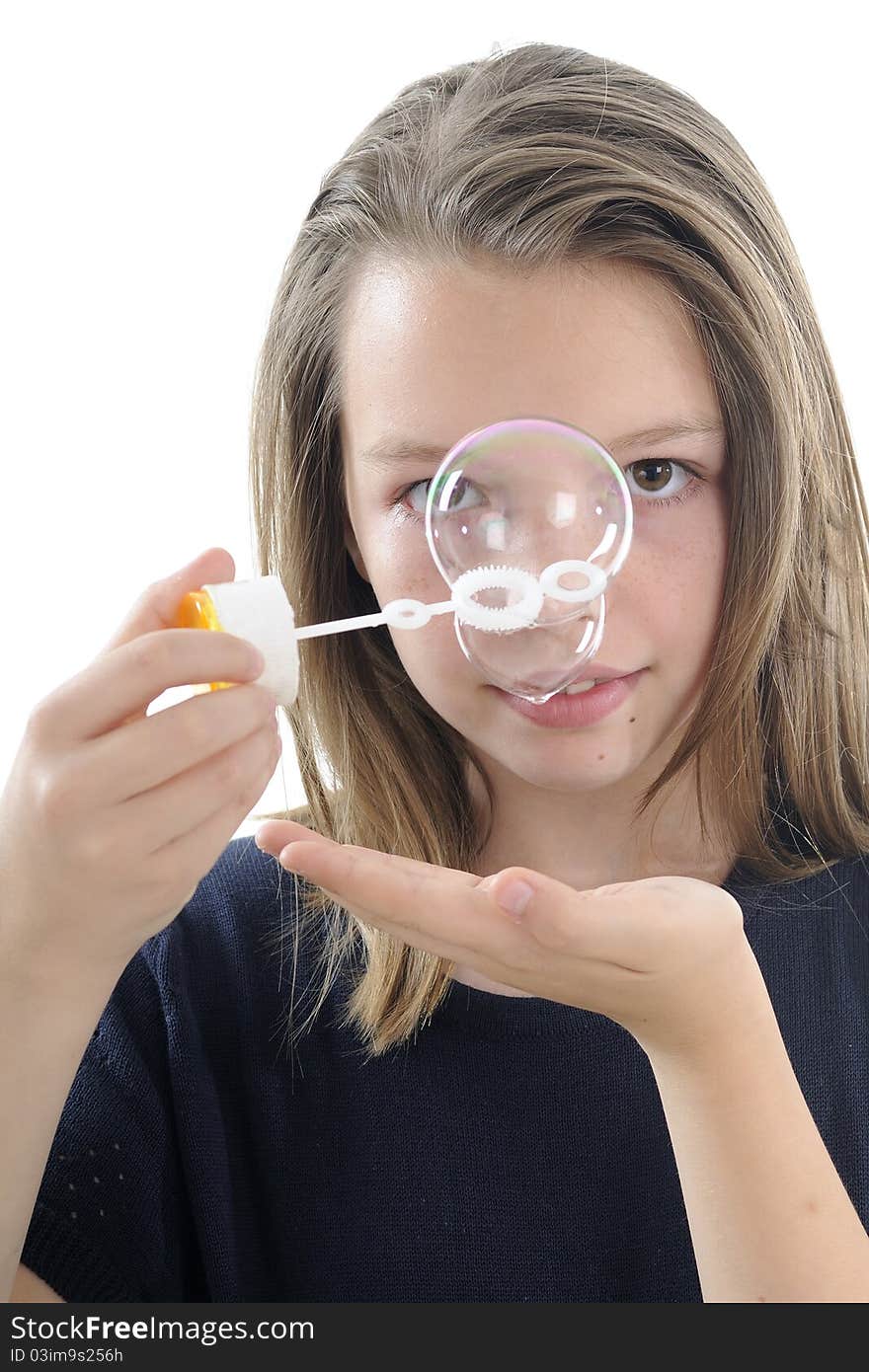 White beautiful  teenager creating bubbles. White beautiful  teenager creating bubbles