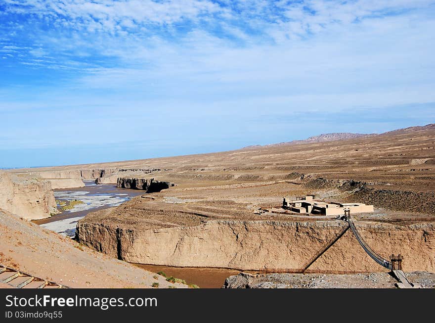 The Yellow River cross yellow earth under blue sky in Gansu，China