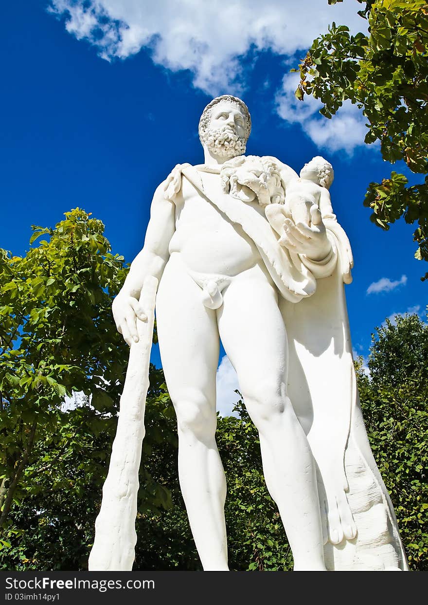 A man hold a baby statue with club