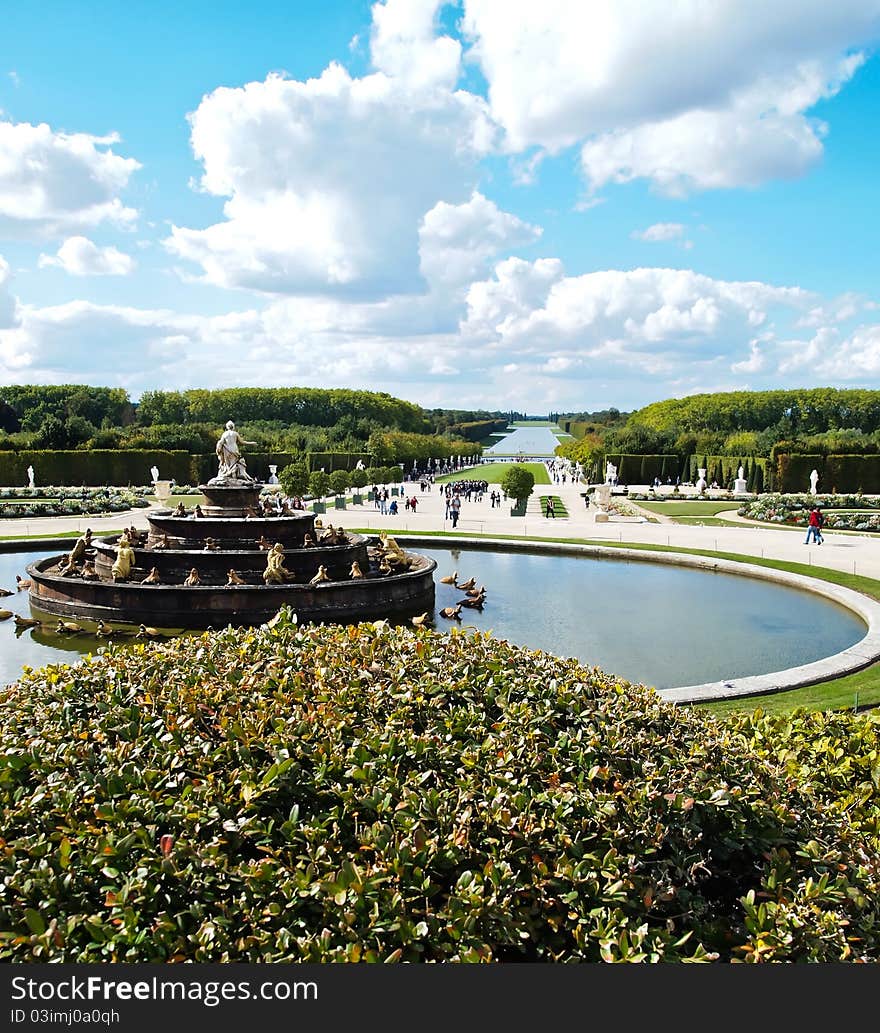 Decorative gardens & fountain with bright blue sky