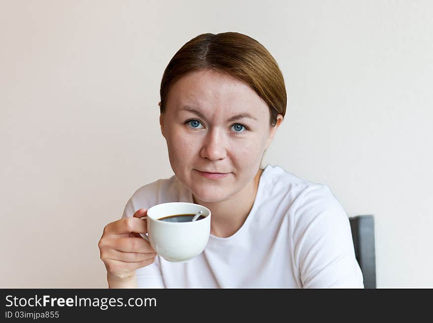 Woman holding a cup of coffee. Woman holding a cup of coffee