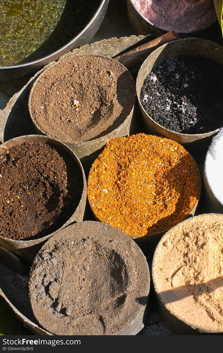 Condiments, seasoning and ground spices for Indian bhelpuri snack at a chaat stand in Pahar Ganj street market, New Delhi, India. Condiments, seasoning and ground spices for Indian bhelpuri snack at a chaat stand in Pahar Ganj street market, New Delhi, India.