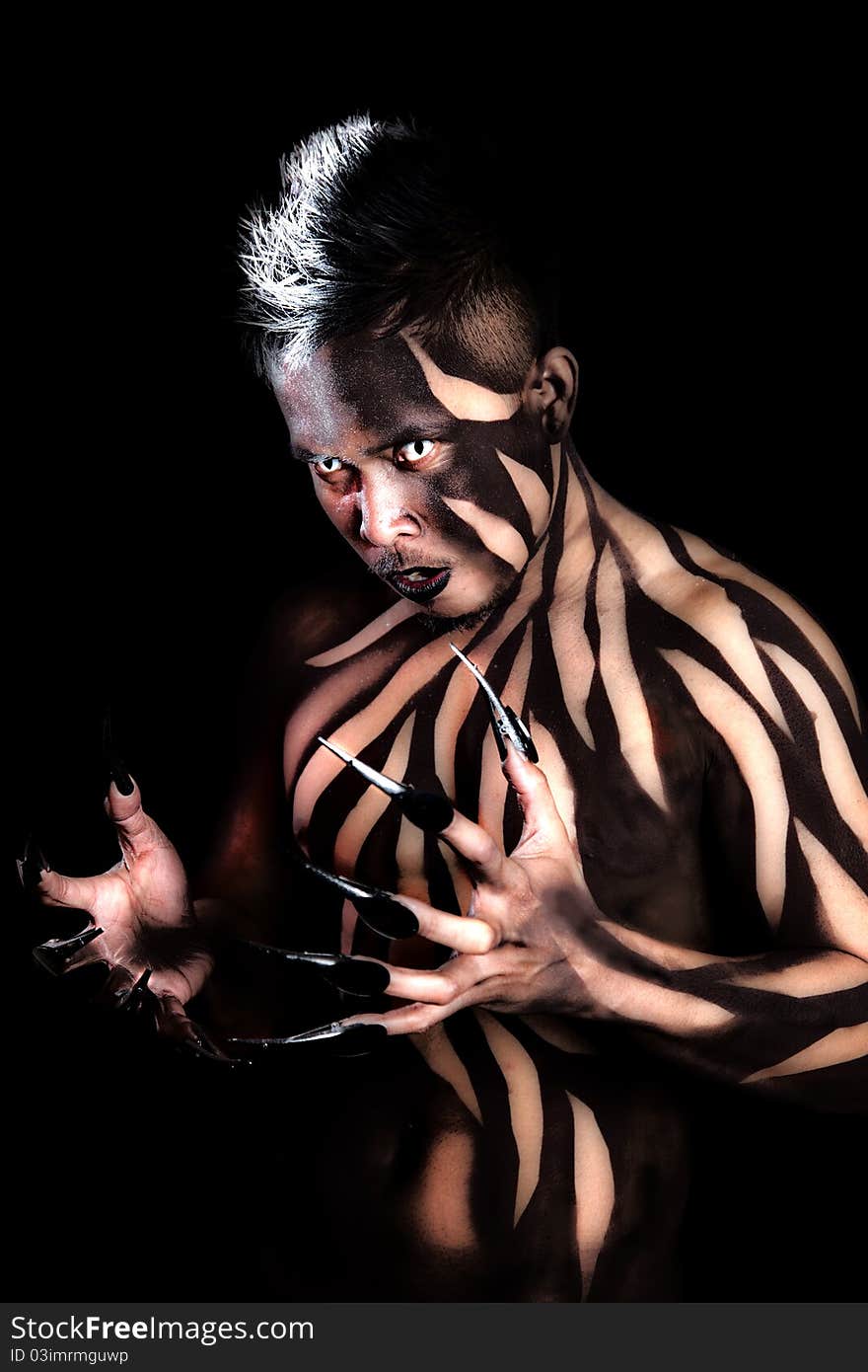 Male with body paint and claws