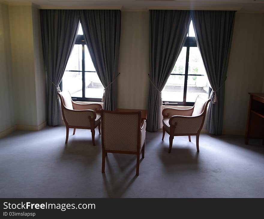 Tree chairs in the empty room