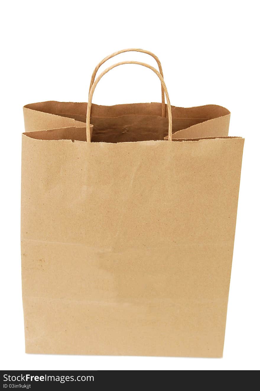 A single brown bag isolated white. A single brown bag isolated white