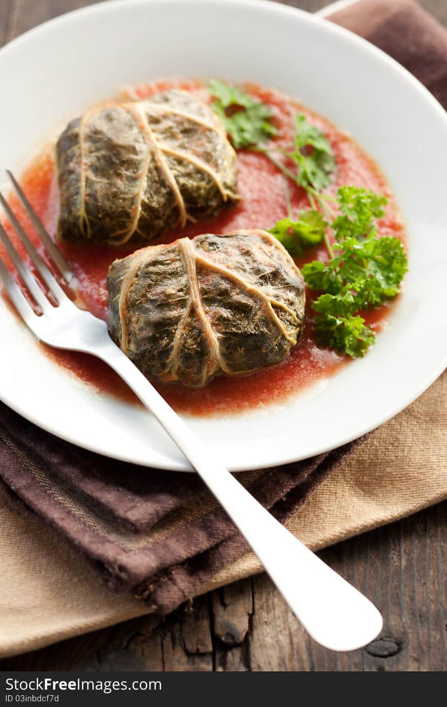 Rustic food, armenian or greek dolmades wrapped with rhubarb leaves, meat and rice. Rustic food, armenian or greek dolmades wrapped with rhubarb leaves, meat and rice