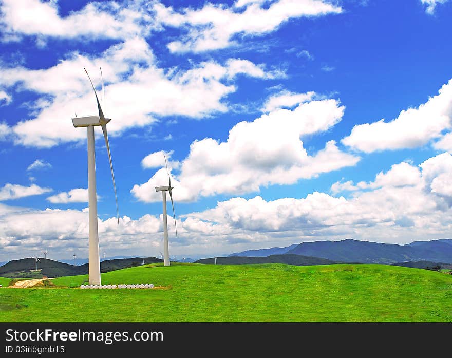 Windmill on  a plain  under blue