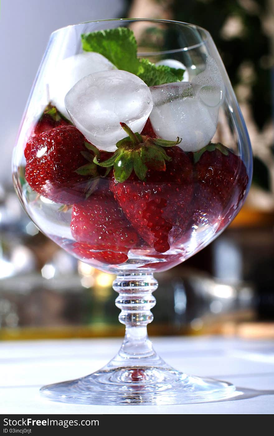 Fresh strawberries on ice in brandy glass. Fresh strawberries on ice in brandy glass