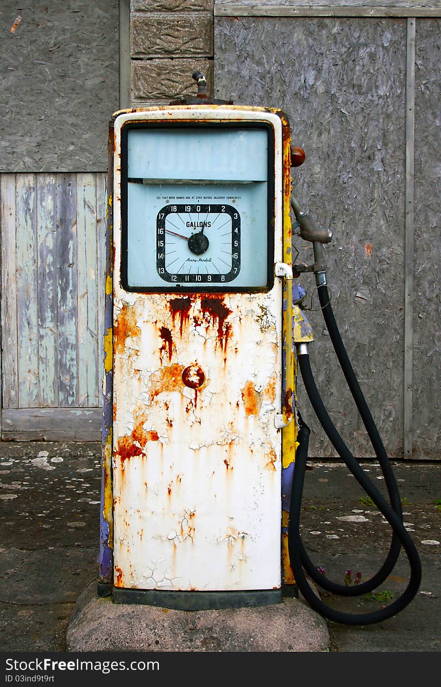 A derelict Village gasoline/petrol pump which has fallen into disrepair and is decaying and rusting away. A derelict Village gasoline/petrol pump which has fallen into disrepair and is decaying and rusting away.