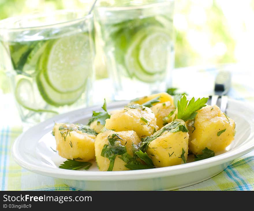 Potato salad with parsley and olive oil. Selective focus