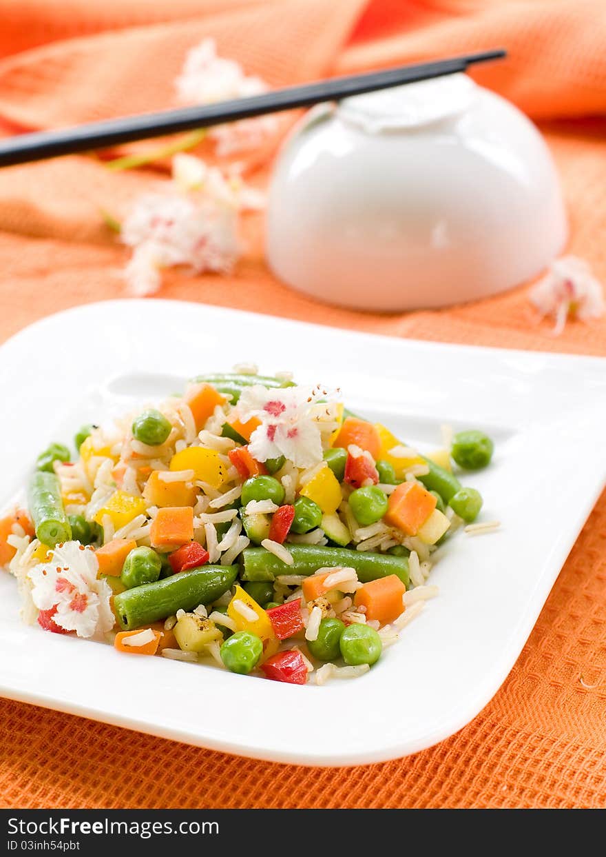 Rice with vegetable on white plate. Selective focus