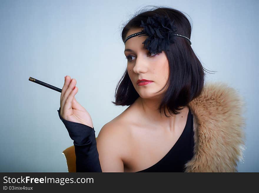 Retro portrait of a young woman in studio