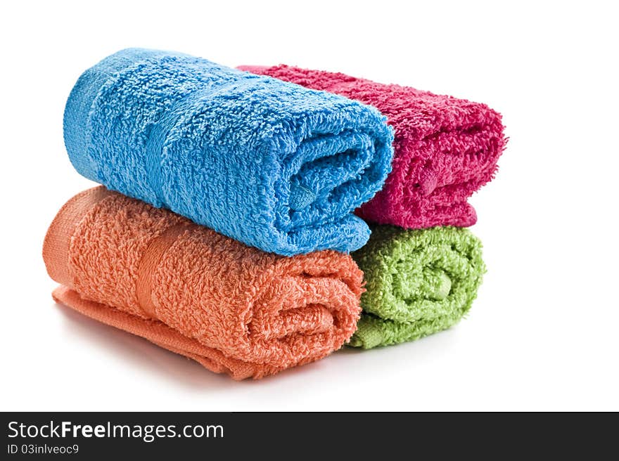 Fresh rolled up towels on a white background