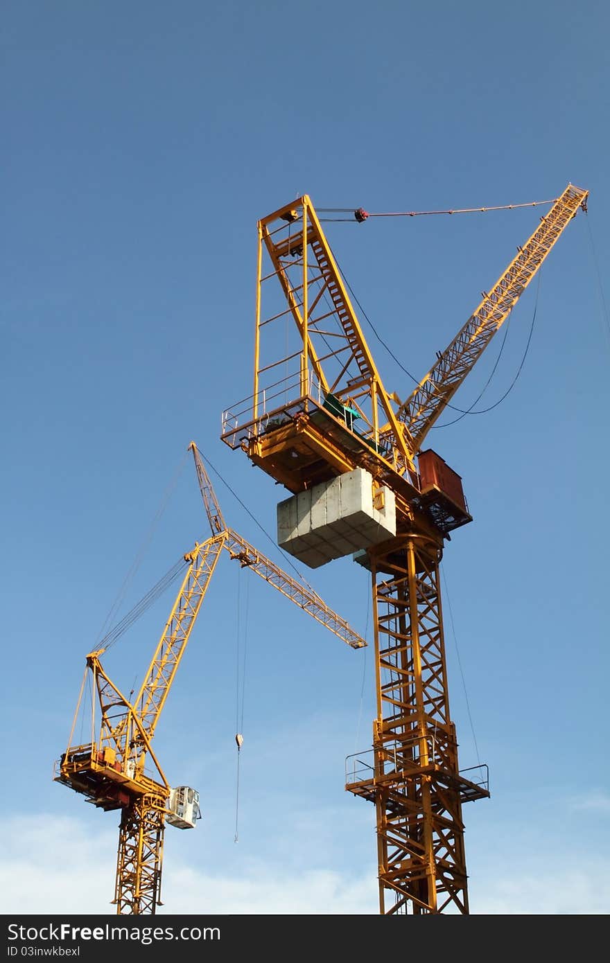 Construction crane in site with blue sky. Construction crane in site with blue sky