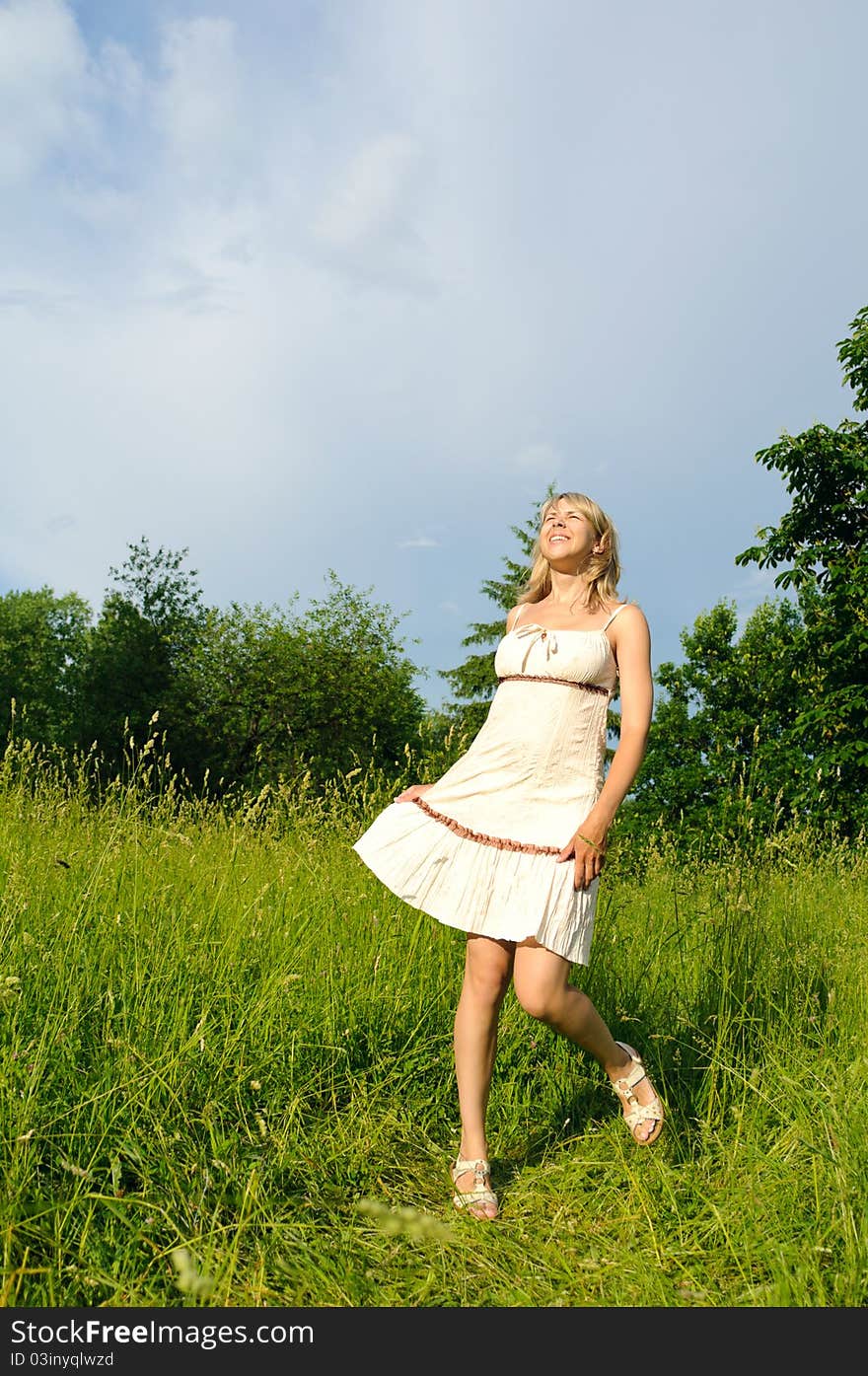 Dancing woman on the meadow