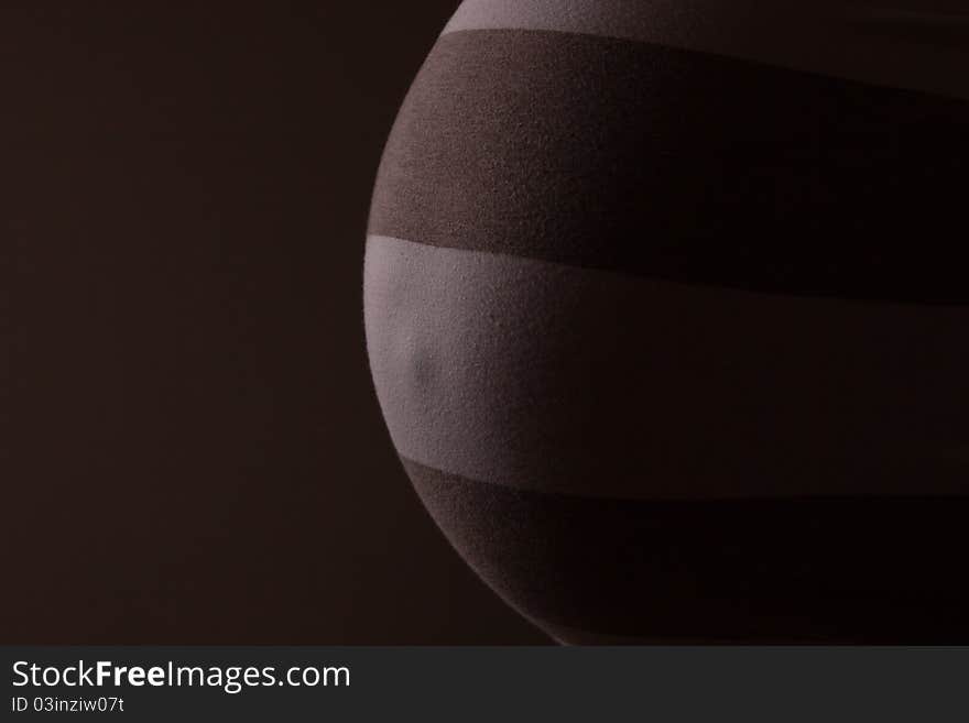 pregnant woman belly on black background