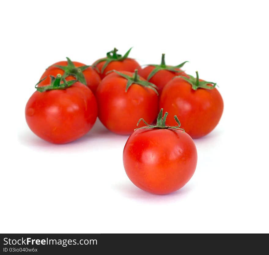 Red tomatoes isolated on a white background