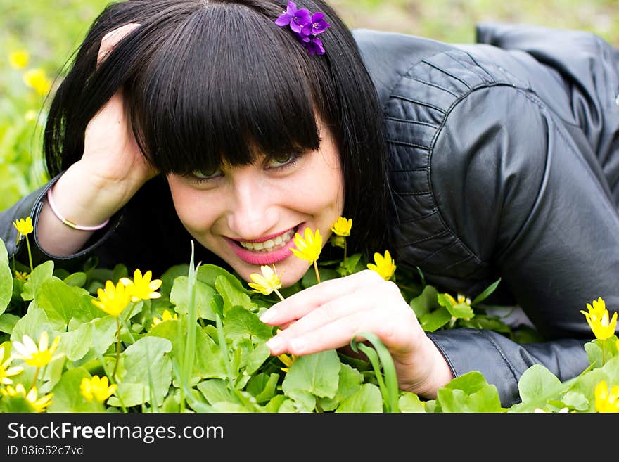 Woman sniffing flowers