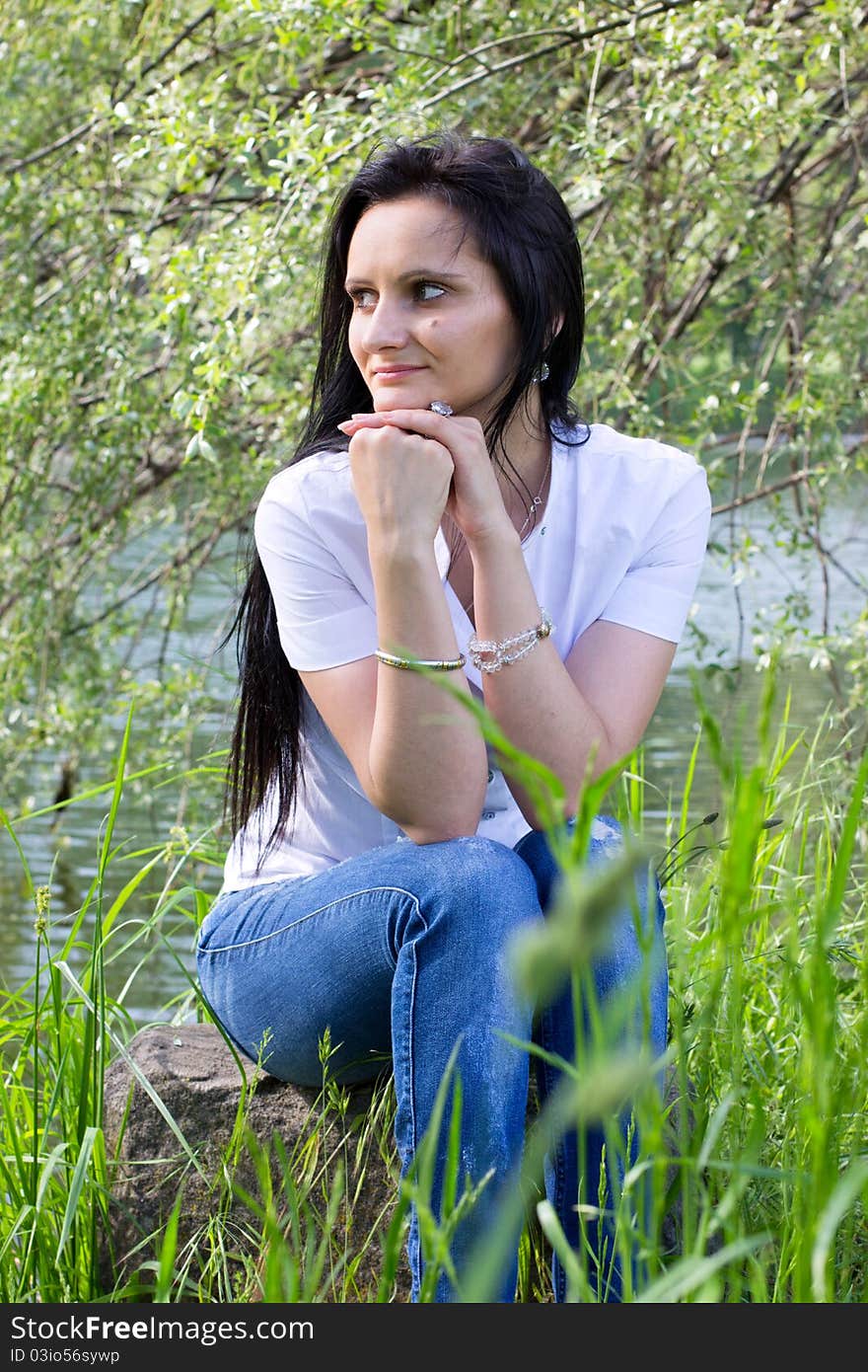 Smiling woman relaxing at the park. Smiling woman relaxing at the park