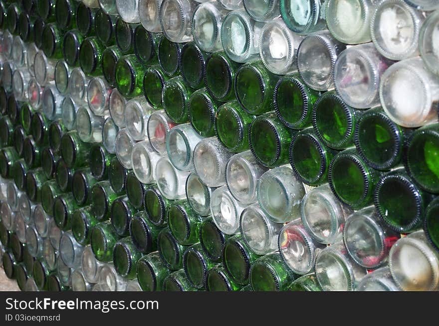 A lot of beer bottle arrange in a row .