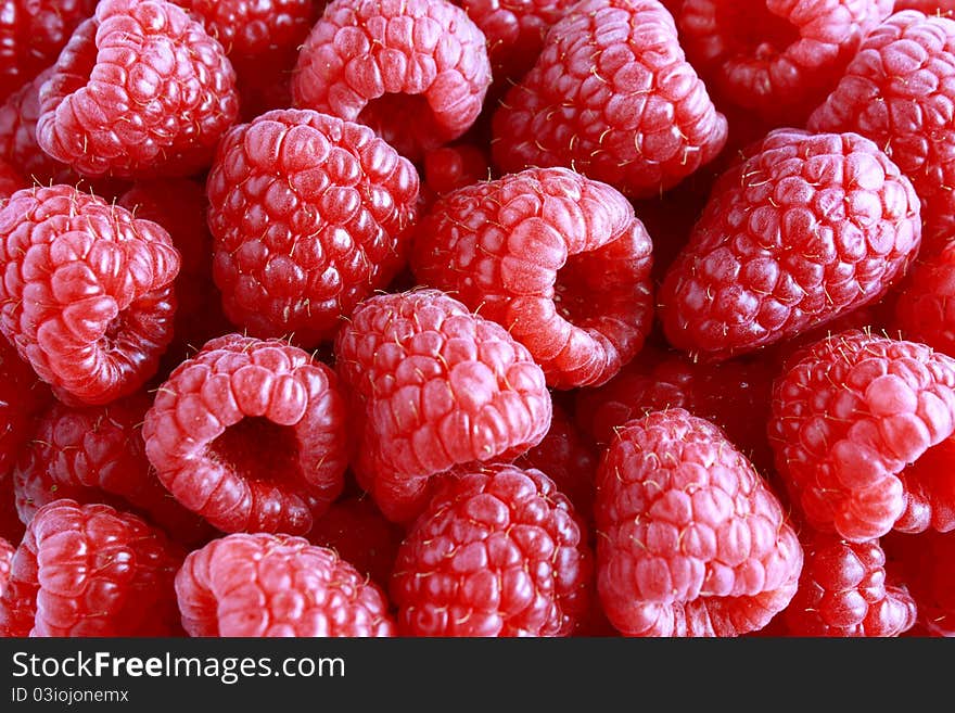 Ripe sweet fresh raspberries background