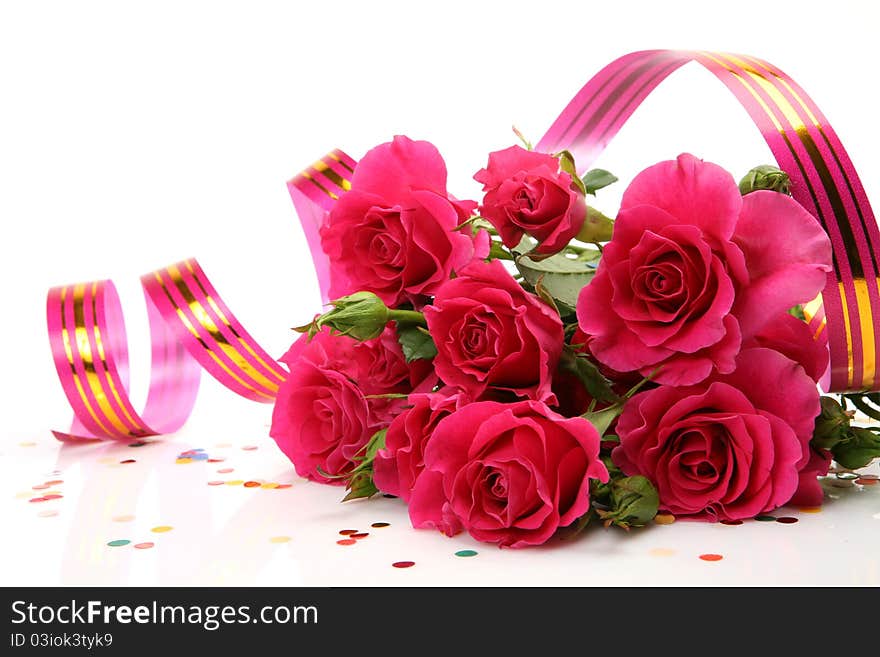 Bouquet of roses and streamer on a white background