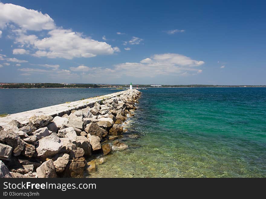 Landscape with breakwater receding into the distance