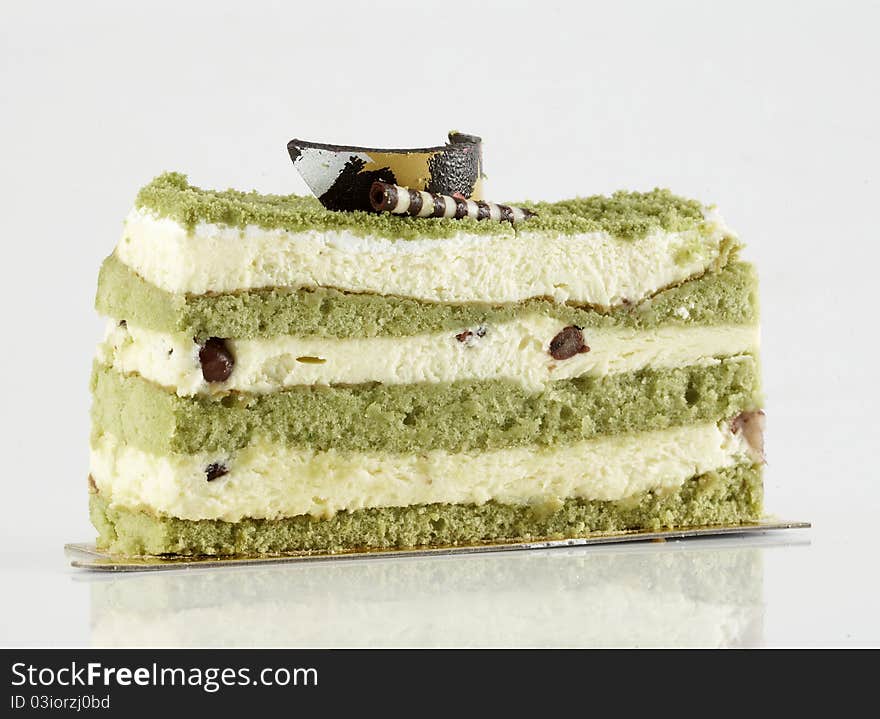 Green tea cake on white background