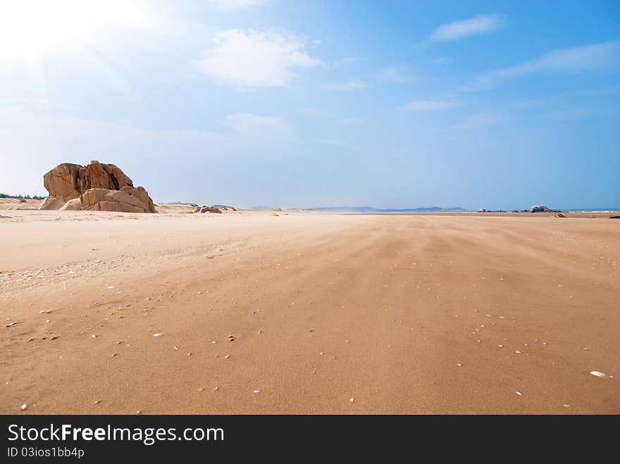 Empty seaside beach and blue sky