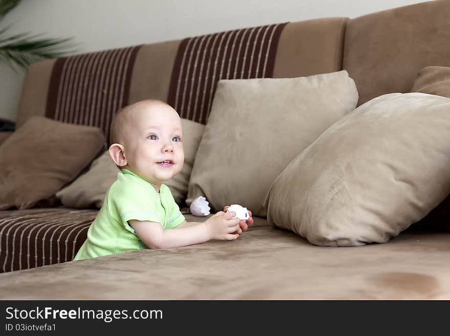 Sweet funny little baby dreamer at home