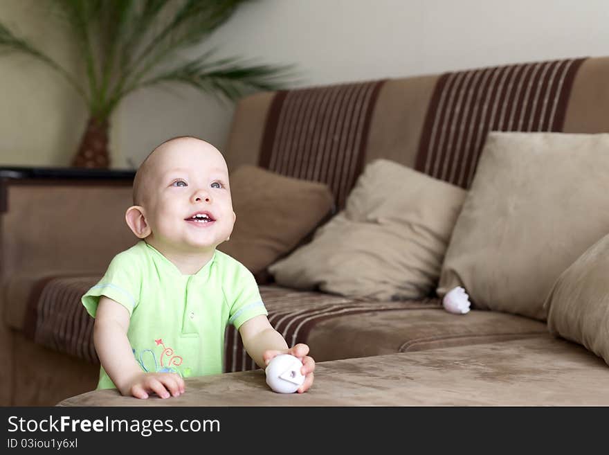 Sweet funny little baby dreamer at home