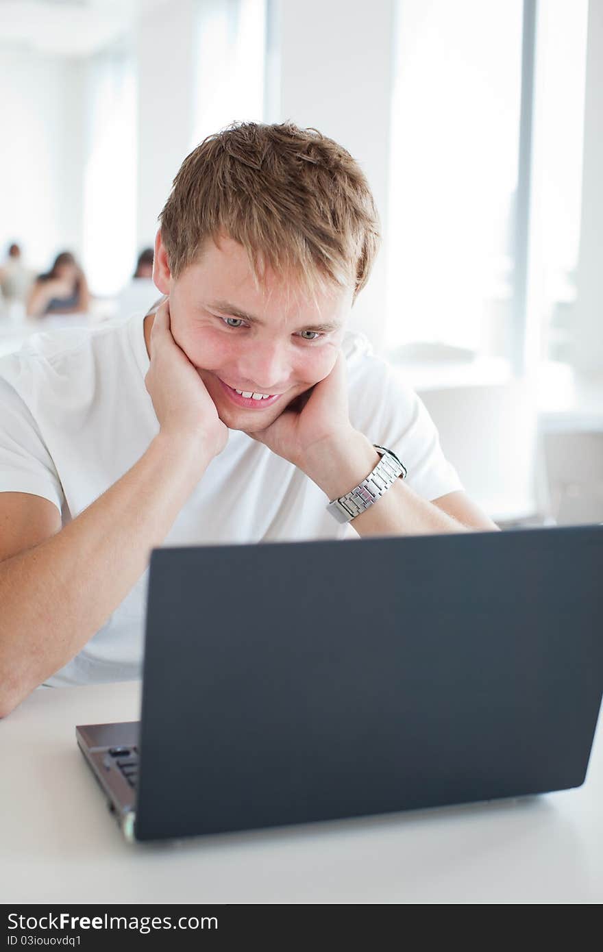 Student with laptop computer in  library